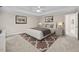 Serene bedroom with plush carpet, neutral tones, and ample natural light at 5109 Windance Pl, Holly Springs, NC 27540