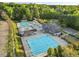 Aerial view of the community pool area featuring multiple pools, slides, and ample seating at 5109 Windance Pl, Holly Springs, NC 27540