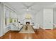 Inviting living room boasts hardwood floors, a fireplace, and large windows for ample natural light at 5109 Windance Pl, Holly Springs, NC 27540