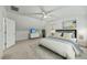 Bedroom with sloped ceilings features a ceiling fan, TV, dresser, and a comfortable bed at 5109 Windance Pl, Holly Springs, NC 27540