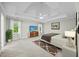 Spacious main bedroom with tray ceiling, carpet flooring, and abundant natural light at 5109 Windance Pl, Holly Springs, NC 27540