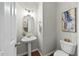 Charming powder room with pedestal sink, modern fixtures, and stylish decor at 5109 Windance Pl, Holly Springs, NC 27540