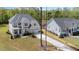 Expansive aerial view of the property, highlighting its spacious lot, well-manicured lawn, and the home's architectural design at 5180 Glen Creek Trl, Garner, NC 27529