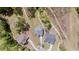Aerial view showcases the property's placement among lush greenery and neighboring homes at 5180 Glen Creek Trl, Garner, NC 27529
