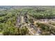 Aerial view showcases houses in a community surrounded by lush greenery and roads at 5180 Glen Creek Trl, Garner, NC 27529