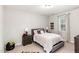 Cozy bedroom with neutral walls, an accent tapestry, and a comfortable full-sized bed at 5180 Glen Creek Trl, Garner, NC 27529