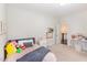 Charming bedroom with plush toys, soft bedding, and a view of the hallway at 5180 Glen Creek Trl, Garner, NC 27529