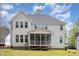 Back exterior view of home showcasing a porch and well-maintained yard at 5180 Glen Creek Trl, Garner, NC 27529