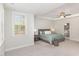 Inviting main bedroom featuring a tray ceiling, a comfortable bed, and bedside tables at 5180 Glen Creek Trl, Garner, NC 27529