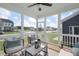 Inviting screened porch with cozy seating, stylish décor, and views of the neighborhood at 540 Folk Song Way, Wendell, NC 27591