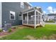 Side view of screened porch with an air conditioning unit and green grass at 540 Folk Song Way, Wendell, NC 27591