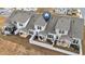 Aerial view of townhomes showing fenced backyards with covered patios at 53 Whitley Ridge Dr, Clayton, NC 27527