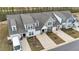 Overhead view of townhomes with attached garages, landscaping, and community layout at 53 Whitley Ridge Dr, Clayton, NC 27527