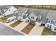 Aerial view of townhomes showcasing their layout, landscaping, and neighborhood at 53 Whitley Ridge Dr, Clayton, NC 27527