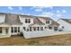 Back view of homes with covered patios and fenced backyards at 53 Whitley Ridge Dr, Clayton, NC 27527