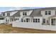View of townhomes from backyard showcasing covered patios and privacy fences at 53 Whitley Ridge Dr, Clayton, NC 27527