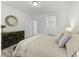 Inviting bedroom showcasing wood floors, neutral colors, and a decorative dresser at 53 Whitley Ridge Dr, Clayton, NC 27527