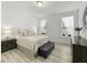 Cozy bedroom with wood floors, soft bedding, and natural light from windows at 53 Whitley Ridge Dr, Clayton, NC 27527