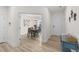 Hallway leading to a dining area with hardwood floors and a view of the front door at 53 Whitley Ridge Dr, Clayton, NC 27527