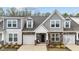 Attractive townhome showcasing stone accents, neutral siding, and a welcoming front entrance at 53 Whitley Ridge Dr, Clayton, NC 27527