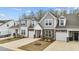 Attractive townhomes with stone accents, attached garages, and manicured front yards at 53 Whitley Ridge Dr, Clayton, NC 27527