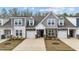 Inviting townhome showcasing varied siding, attached garages and landscaped front yards, offering curb appeal at 53 Whitley Ridge Dr, Clayton, NC 27527