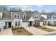 Charming townhomes with stone accents, attached garages, and well-maintained landscaping at 53 Whitley Ridge Dr, Clayton, NC 27527