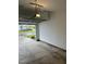 Spacious garage with an open door and a view of the neighborhood at 53 Whitley Ridge Dr, Clayton, NC 27527