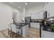 Spacious kitchen featuring an island with seating, stainless steel appliances, and ample counter space at 53 Whitley Ridge Dr, Clayton, NC 27527