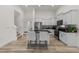 Modern kitchen with an island, stainless steel appliances, and an open layout for seamless entertaining at 53 Whitley Ridge Dr, Clayton, NC 27527
