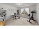 Bright home office with natural light, a desk setup, and exercise equipment at 53 Whitley Ridge Dr, Clayton, NC 27527