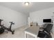Bright office featuring neutral walls, a Peloton bike, and a work area at 53 Whitley Ridge Dr, Clayton, NC 27527