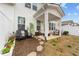 Charming covered patio features two Adirondack chairs and outdoor seating with a stone walkway at 53 Whitley Ridge Dr, Clayton, NC 27527
