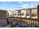 Balcony view showing neighborhood townhomes and garages at 5432 Crescent Square St, Raleigh, NC 27616
