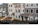 View of townhome exteriors, showcasing a blend of colors and architectural details at 5432 Crescent Square St, Raleigh, NC 27616