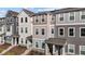 Attractive townhome exteriors showing multi-tonal facades and covered entrances at 5432 Crescent Square St, Raleigh, NC 27616