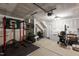 Spacious garage featuring workout equipment and storage, perfect for fitness enthusiasts and organization at 5432 Crescent Square St, Raleigh, NC 27616