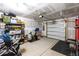 Well-organized garage with storage solutions, exercise bike, and room for parking, offering convenience and functionality at 5432 Crescent Square St, Raleigh, NC 27616