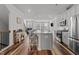 Bright, open kitchen features stainless steel appliances, large island with seating at 5432 Crescent Square St, Raleigh, NC 27616