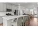 Spacious kitchen featuring stainless steel appliances and a large quartz island at 5432 Crescent Square St, Raleigh, NC 27616