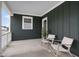 Inviting covered porch with stylish seating, offering a relaxing outdoor space to enjoy fresh air at 548 Folk Song Way, Wendell, NC 27591