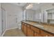 Spacious bathroom featuring double sinks, granite counters, a shower and toilet at 563 Tomkins Loop, Cary, NC 27519