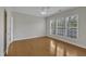 Bedroom with hardwood floors, a ceiling fan and plenty of natural light at 563 Tomkins Loop, Cary, NC 27519