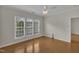 Bright bedroom featuring hardwood floors and lots of natural light at 563 Tomkins Loop, Cary, NC 27519
