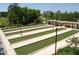 Bocce ball court featuring multiple lanes and well-manicured lawns and landscaping at 563 Tomkins Loop, Cary, NC 27519