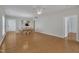 Dining area featuring hardwood floors, a ceiling fan, and views into an adjacent kitchen at 563 Tomkins Loop, Cary, NC 27519
