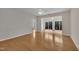 Bright living room with hardwood floors and access to sunroom with natural light at 563 Tomkins Loop, Cary, NC 27519
