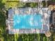 Aerial view of a pristine pool surrounded by a well-maintained patio and landscape at 5816 Sand Pebble Pl, Raleigh, NC 27613