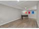 Finished basement featuring a foosball table and minimalist abstract art at 5816 Sand Pebble Pl, Raleigh, NC 27613