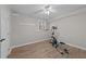Basement workout area with an elliptical machine and a window view at 5816 Sand Pebble Pl, Raleigh, NC 27613